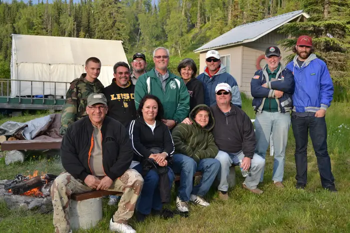 The group gathered outside the cabins on arrival