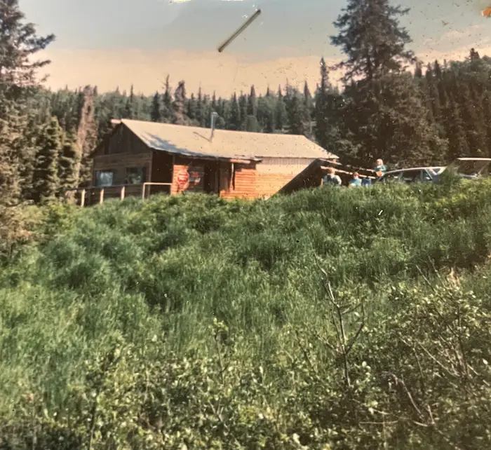 The original cabin on the gravel road, early days of the camp