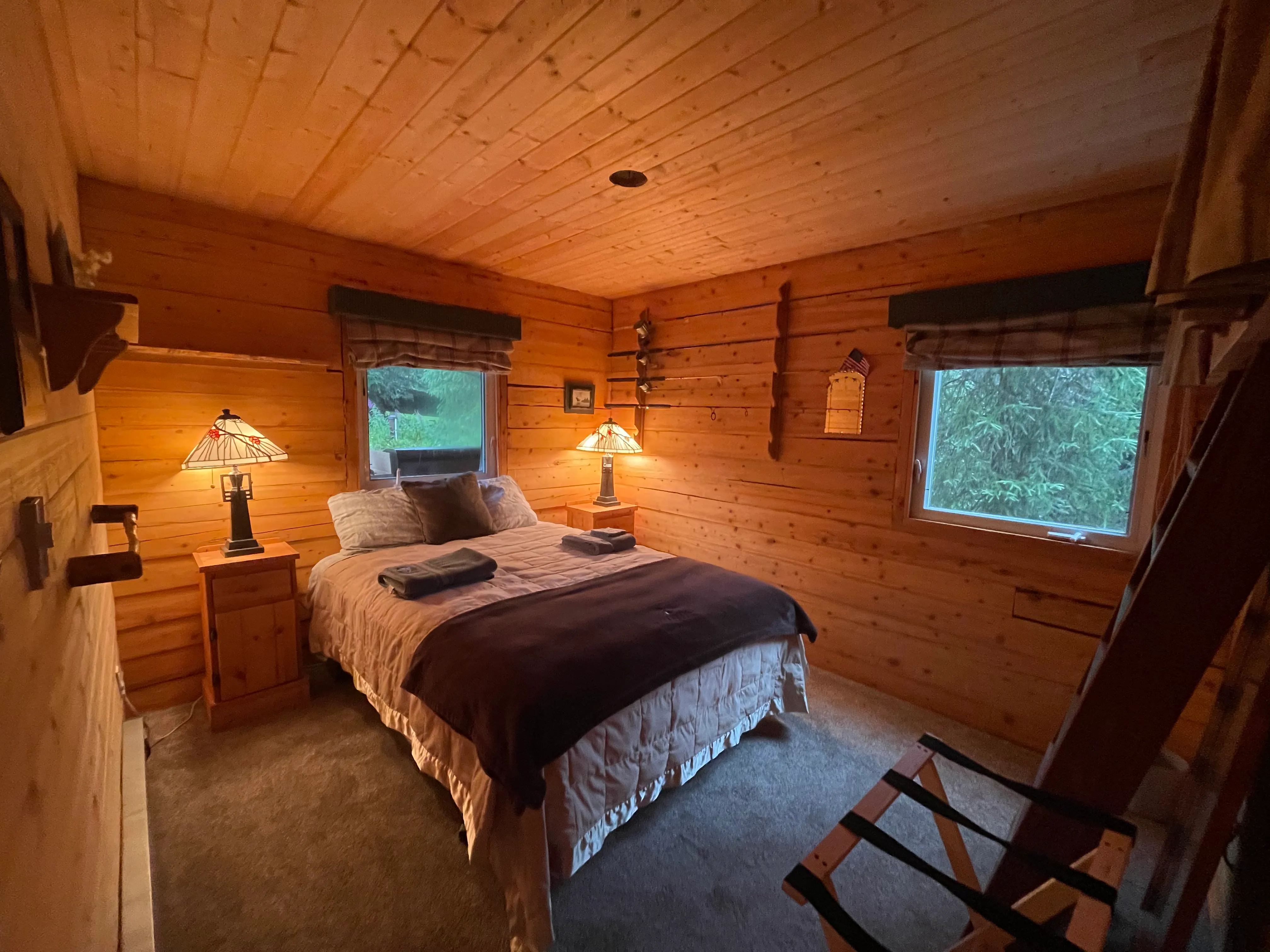A cozy knotty-pine bedroom at the lodge