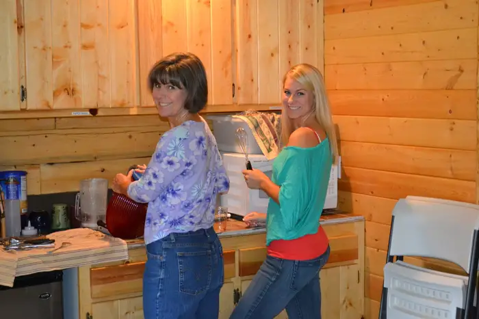 Laughing together in the kitchen after the meal