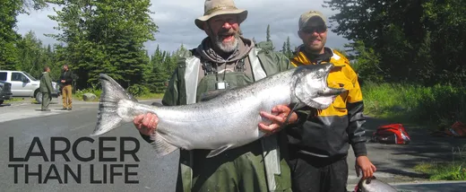 Anglers showing off a haul of sockeye salmon on the water