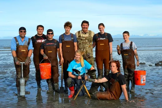 Group of guests and guides lined up on the beach