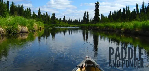 Group of guests wading and fishing together in the river.