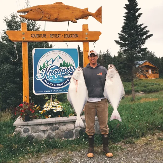 Group of guests on the dock with a full day's catch of halibut and salmon.
