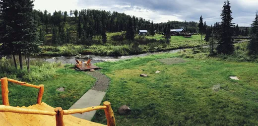 Green meadow and lodge property from an elevated view