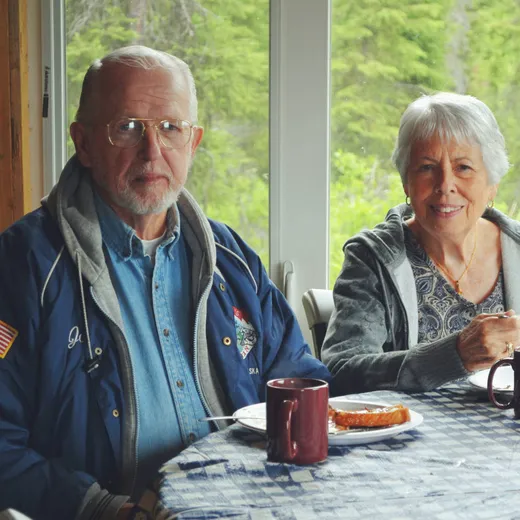 Older couple enjoying a meal outdoors at the fishcamp.