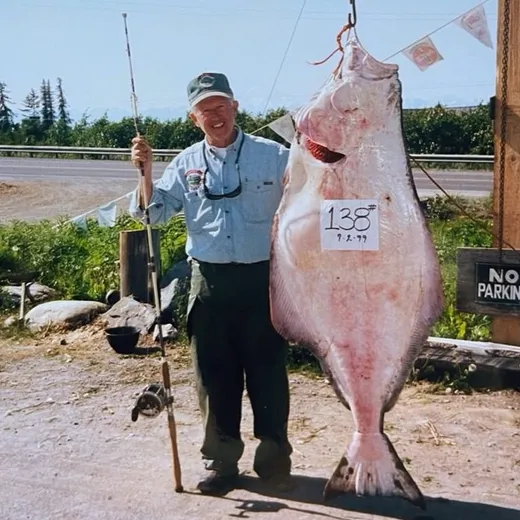 Angler displays a big halibut caught on the trip.