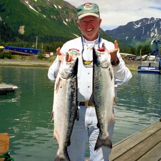 Two guests show off a double salmon haul.