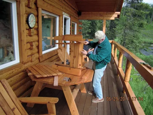 Cabin deck and exterior with mountain views beyond.