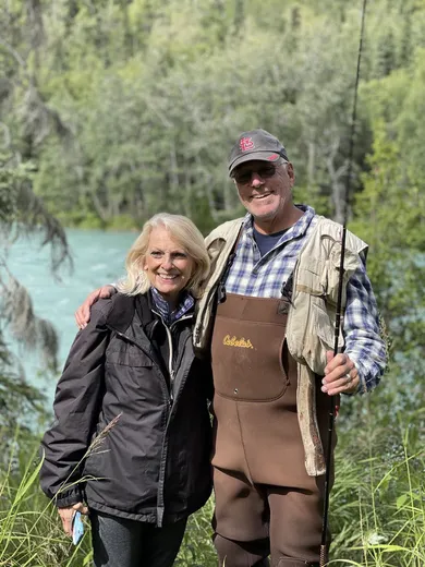 Two smiling guests or guides posing outdoors