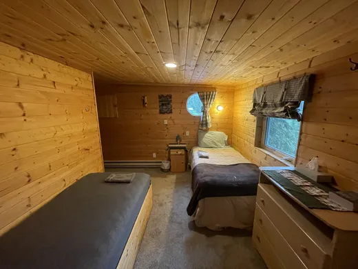 Clean wood-paneled guest room interior